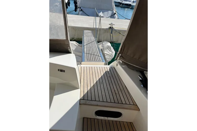  Yacht Photos Pics Prestige 620 yacht gangway, 2013 model, with wooden deck and marina view.