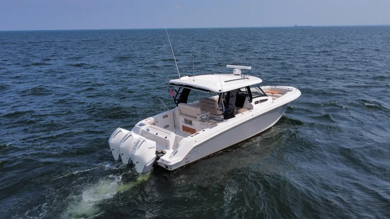  Yacht Photos Pics 2022 Boston Whaler 350 Realm cruising on open water.