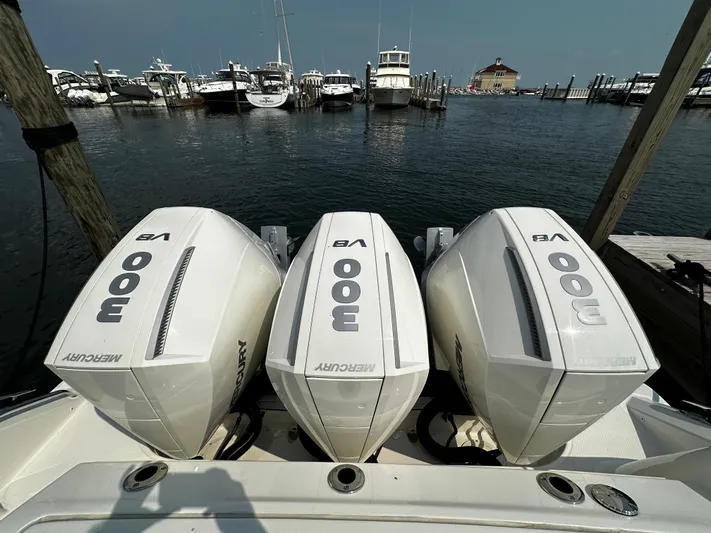 Yacht Photos Pics Triple Mercury 300 V8 engines on a 2022 Boston Whaler 350 Realm at a marina.