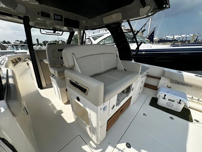  Yacht Photos Pics 2022 Boston Whaler 350 Realm interior with luxurious seating and modern design.
