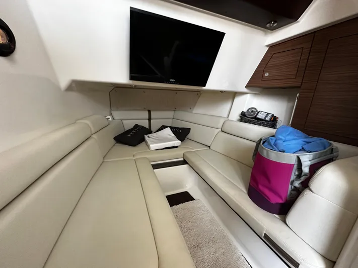  Yacht Photos Pics Interior of 2022 Boston Whaler 350 Realm, featuring plush seating and a mounted TV.