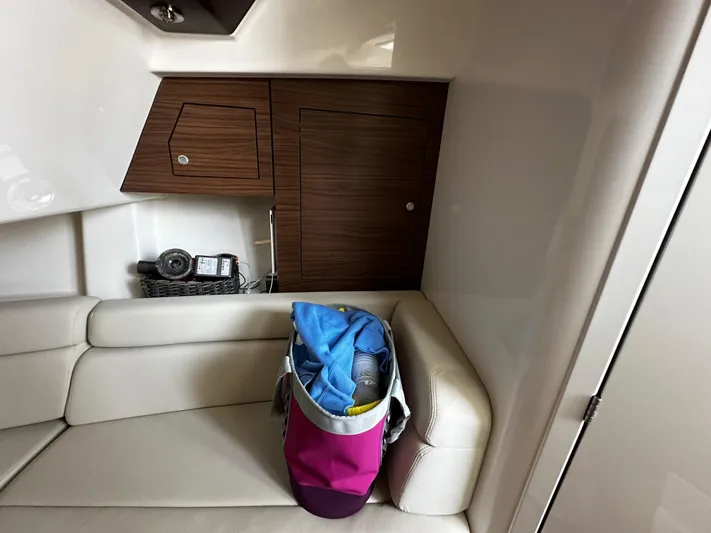  Yacht Photos Pics Interior of 2022 Boston Whaler 350 Realm with seating and storage compartments.