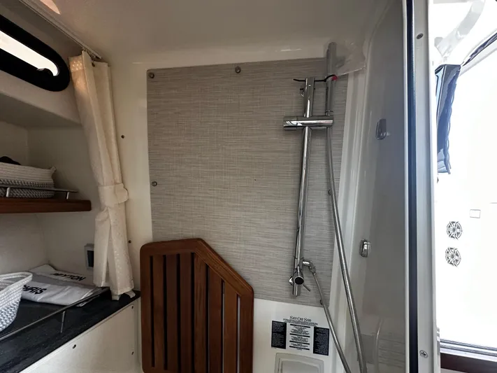  Yacht Photos Pics Interior of 2022 Boston Whaler 350 Realm, featuring a modern shower area.