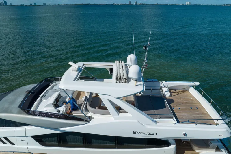 Evolution Yacht Photos Pics 2013 Ferretti Yachts 800 on open water, showcasing sleek design and spacious deck.