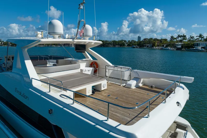 Evolution Yacht Photos Pics Ferretti Yachts 800, 2013 model, luxury yacht on serene water with clear skies.