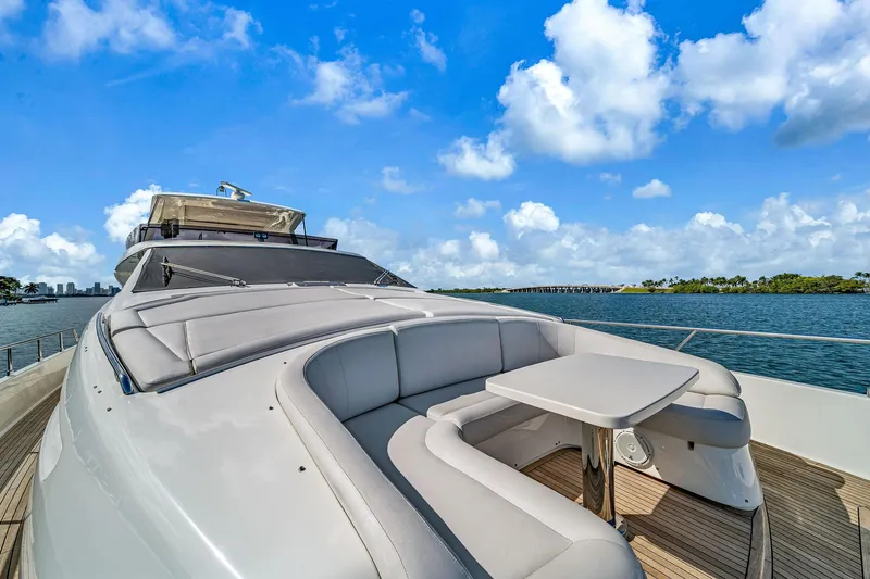 Evolution Yacht Photos Pics Luxurious 2013 Ferretti Yachts 800 with sleek deck and seating, under a bright blue sky.