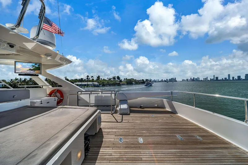 Evolution Yacht Photos Pics Luxurious 2013 Ferretti Yachts 800 deck with ocean view and city skyline.