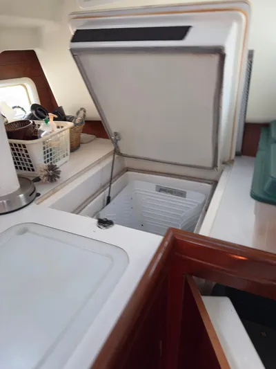  Yacht Photos Pics Open refrigerator in 2000 Beneteau 411 yacht kitchen interior.