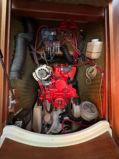  Yacht Photos Pics Engine compartment of a 2000 Beneteau 411 sailboat, showcasing wiring and components.