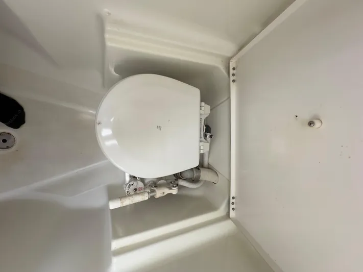  Yacht Photos Pics Toilet in a 2000 Beneteau 411 sailboat, featuring compact marine design.