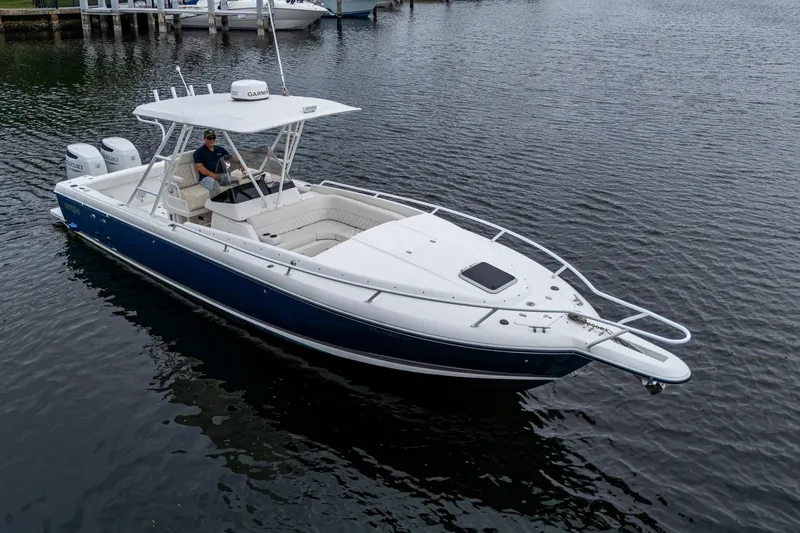  Yacht Photos Pics 2003 Intrepid 323 boat on water, featuring dual engines and sleek design.