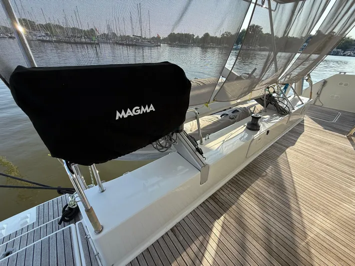 Sirena Yacht Photos Pics Deck of 2015 Fountaine Pajot Helia 44 catamaran with Magma grill cover.