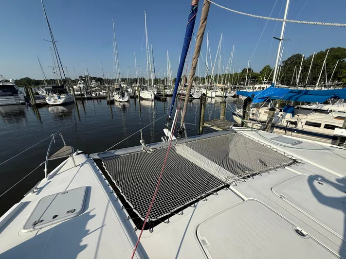 Sirena Yacht Photos Pics 2015 Fountaine Pajot Helia 44 catamaran docked in a marina with other sailboats.