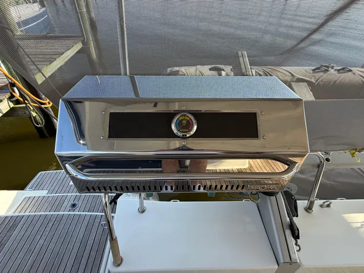 Sirena Yacht Photos Pics Stainless steel grill on a 2015 Fountaine Pajot Helia 44 catamaran deck.