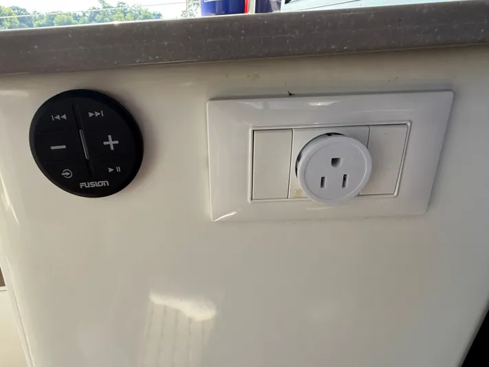 Sirena Yacht Photos Pics Control panel and power outlet on 2015 Fountaine Pajot Helia 44 yacht interior.