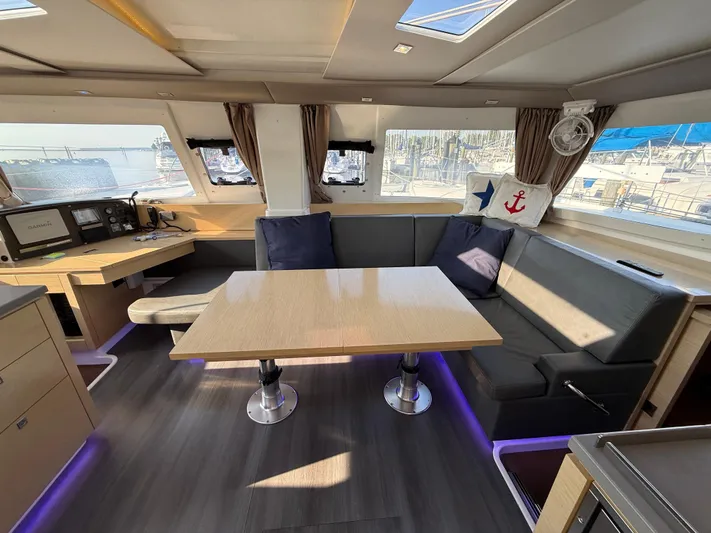 Sirena Yacht Photos Pics Interior of 2015 Fountaine Pajot Helia 44 catamaran with modern seating and navigation area.