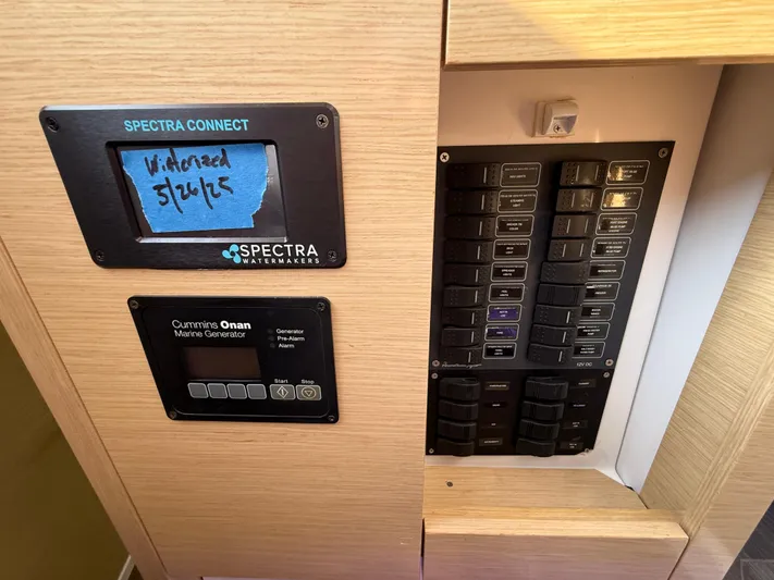 Sirena Yacht Photos Pics Control panel of a 2015 Fountaine Pajot Helia 44 with Spectra Watermakers and Cummins Onan generator.