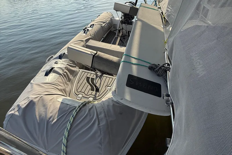 Sirena Yacht Photos Pics Fountaine Pajot Helia 44 catamaran, 2015 model, with covered seating area on calm water.