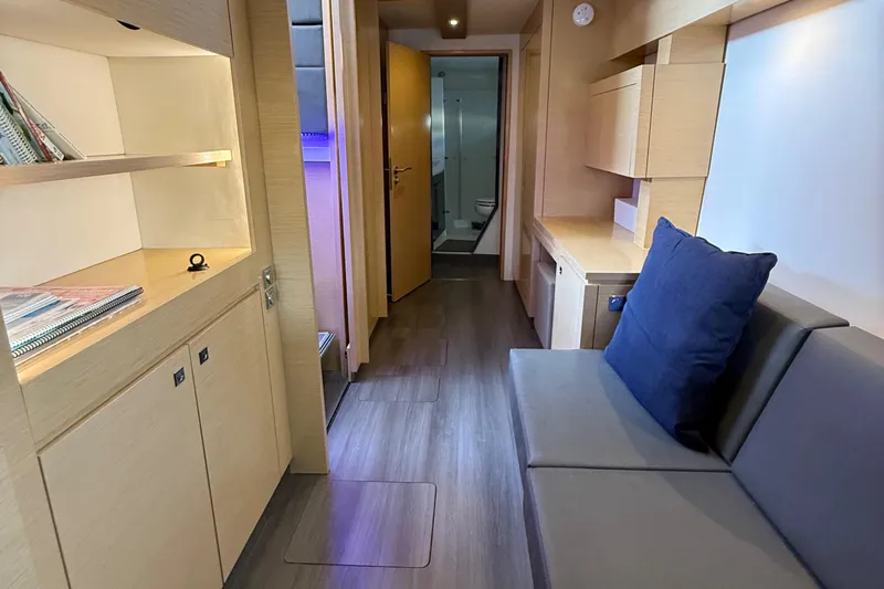 Sirena Yacht Photos Pics Luxurious interior of 2015 Fountaine Pajot Helia 44 catamaran with modern furnishings and cozy seating.