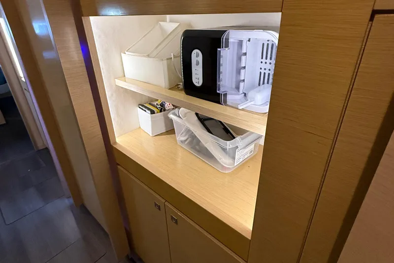 Sirena Yacht Photos Pics Interior storage shelves on a 2015 Fountaine Pajot Helia 44 catamaran.