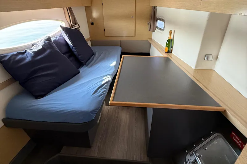 Sirena Yacht Photos Pics Cozy cabin interior of 2015 Fountaine Pajot Helia 44 with seating and table.