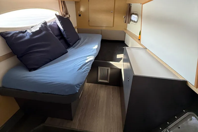 Sirena Yacht Photos Pics Interior cabin of 2015 Fountaine Pajot Helia 44 catamaran with cozy seating and storage.