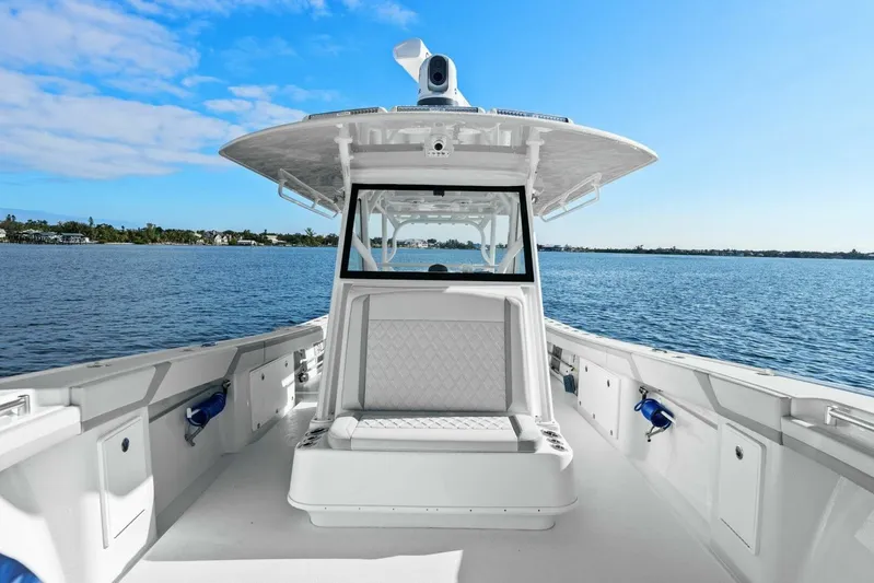  Yacht Photos Pics 2023 Yellowfin 39 Offshore boat on calm water under clear blue sky.