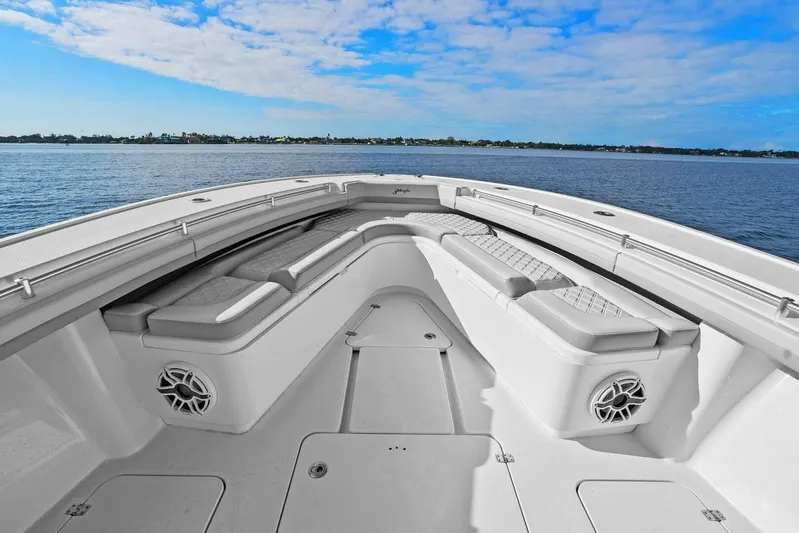  Yacht Photos Pics 2023 Yellowfin 39 Offshore boat interior with cushioned seating and ocean view.