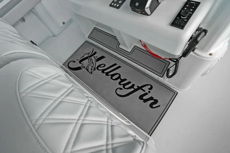  Yacht Photos Pics 2023 Yellowfin 39 Offshore boat interior with logo mat and control panel.