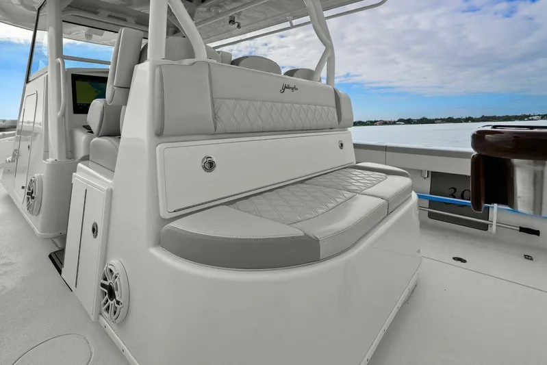  Yacht Photos Pics 2023 Yellowfin 39 Offshore boat interior with cushioned seating and ocean view.