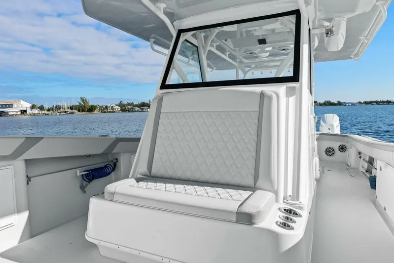  Yacht Photos Pics 2023 Yellowfin 39 Offshore boat interior with cushioned seating and ocean view.