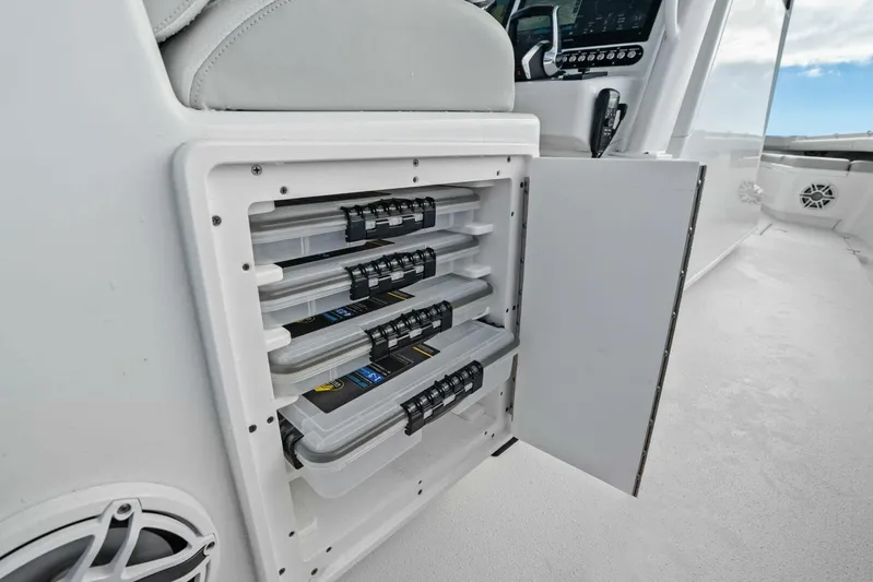 Yacht Photos Pics 2023 Yellowfin 39 Offshore boat storage compartment with organized tackle boxes.