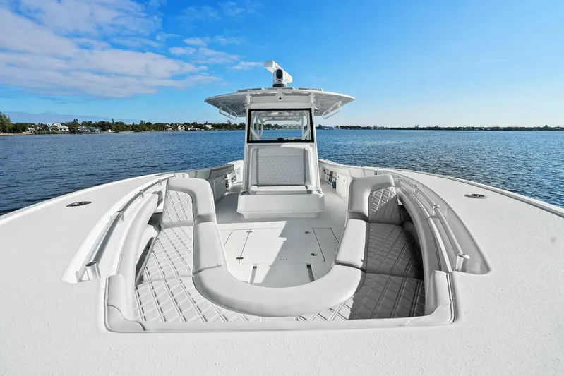  Yacht Photos Pics 2023 Yellowfin 39 Offshore boat with spacious seating on calm water.