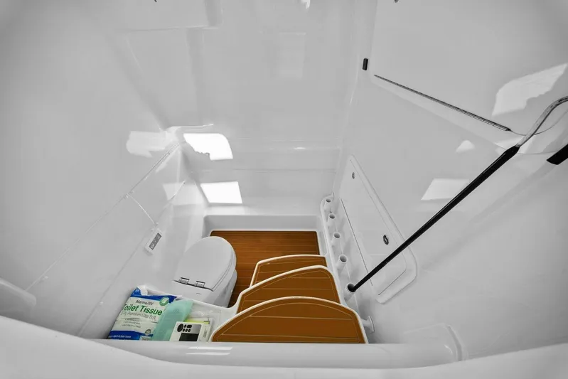  Yacht Photos Pics 2023 Yellowfin 39 Offshore boat interior with toilet and wooden steps.
