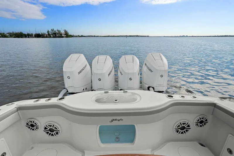  Yacht Photos Pics 2023 Yellowfin 39 Offshore boat with four Mercury outboard engines on calm water.