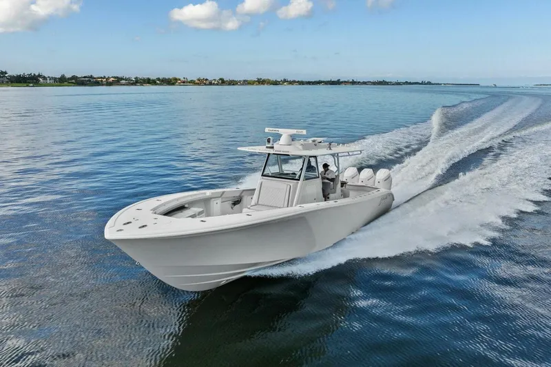  Yacht Photos Pics 2023 Yellowfin 39 Offshore boat cruising on calm blue waters.