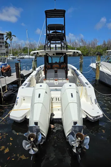 Grey Hawk Yacht Photos Pics 2023 Boston Whaler 360 Outrage boat with dual engines docked in marina.
