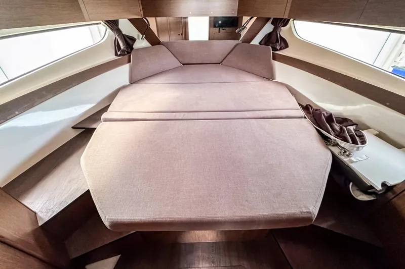  Yacht Photos Pics 2024 Beneteau Antares 11 interior cabin with comfortable bed and modern design.