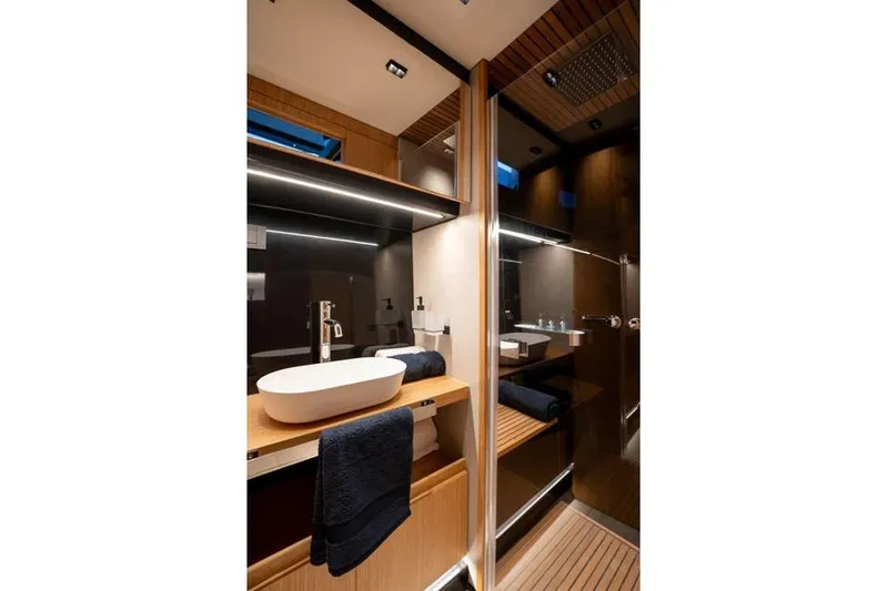  Yacht Photos Pics Luxurious bathroom interior of 2025 De Antonio Yachts D60, featuring modern fixtures and elegant design.