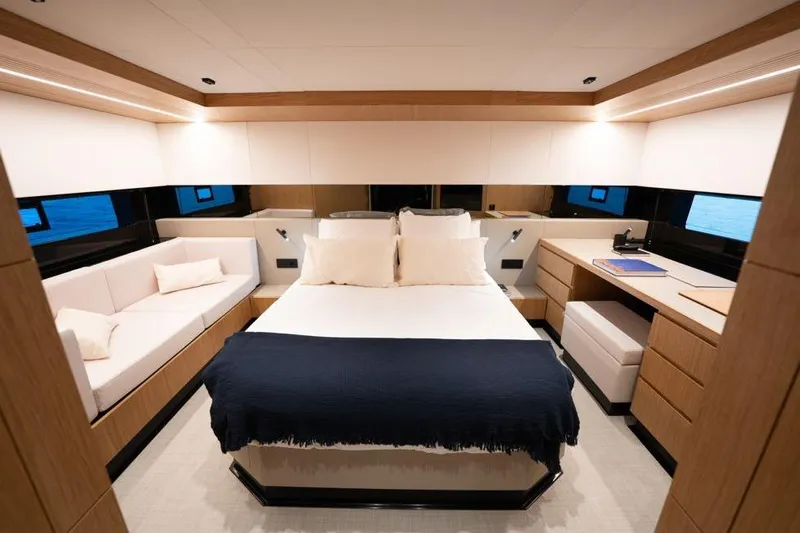  Yacht Photos Pics Luxurious interior of 2025 De Antonio Yachts D60, featuring a cozy bedroom with modern furnishings.