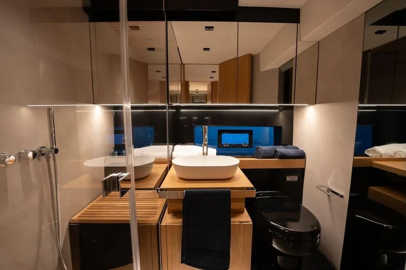  Yacht Photos Pics Luxurious bathroom interior of 2025 De Antonio Yachts D60, featuring modern fixtures and elegant design.