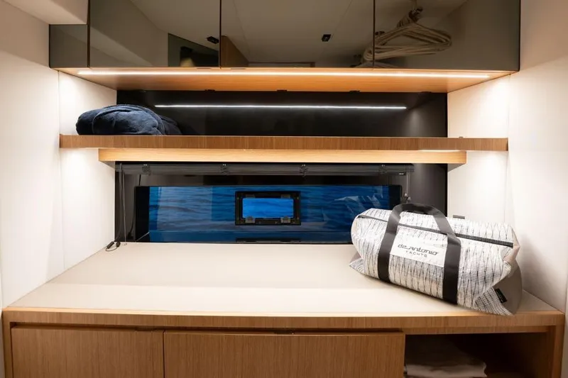  Yacht Photos Pics Interior of 2025 De Antonio Yachts D60, featuring sleek storage and modern design elements.