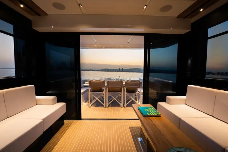  Yacht Photos Pics Luxurious interior of 2025 De Antonio Yachts D60 with ocean view at sunset.