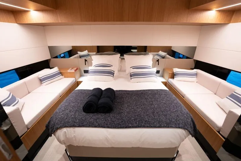  Yacht Photos Pics Luxurious interior of 2025 De Antonio Yachts D60, featuring elegant bedroom design.