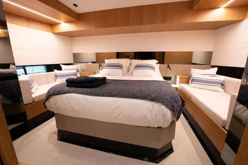  Yacht Photos Pics Luxurious bedroom interior of 2025 De Antonio Yachts D60 with modern design and cozy bedding.