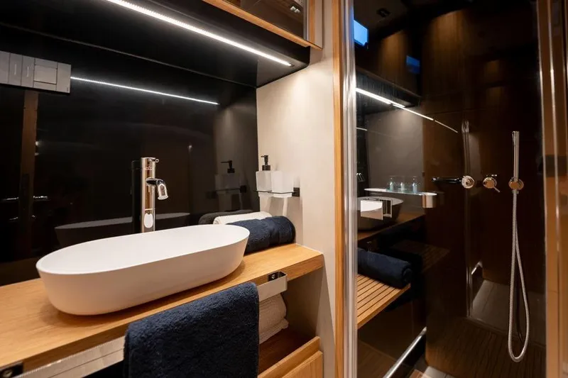  Yacht Photos Pics Luxurious bathroom interior of 2025 De Antonio Yachts D60, featuring modern sink and shower.