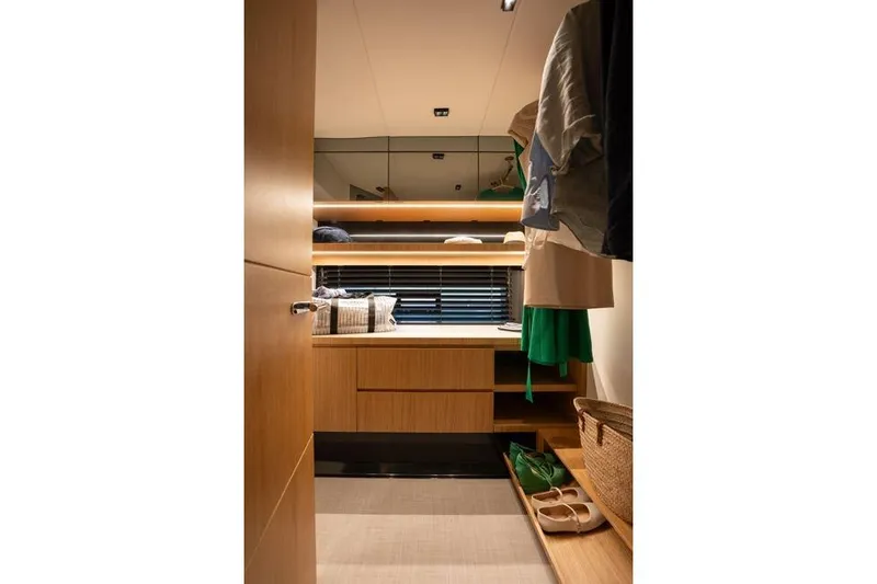  Yacht Photos Pics Luxurious interior of 2025 De Antonio Yachts D60, featuring elegant wood cabinetry and modern design.