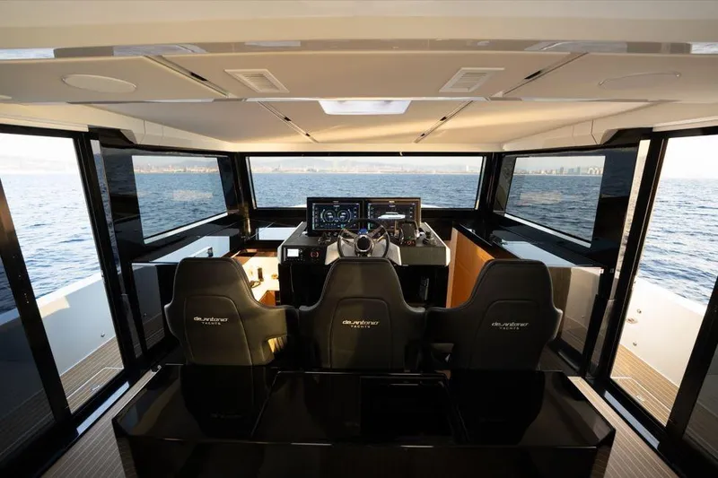  Yacht Photos Pics Interior view of 2025 De Antonio Yachts D60 helm with panoramic ocean view.
