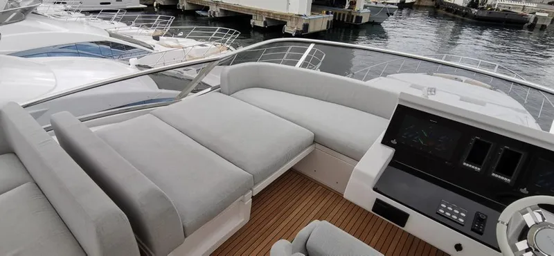 Goldinia Yacht Photos Pics Luxurious 2021 Azimut 72 yacht with spacious deck seating and modern control panel.