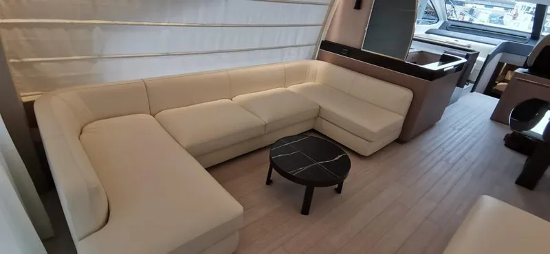 Goldinia Yacht Photos Pics Luxurious interior of 2021 Azimut 72 yacht with elegant beige seating and modern decor.